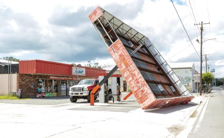 The canopy over the gas pumps at the Mayo Food Mart on W. Main Street was toppled by the winds during Hurricane Helene. (JACK HOWDESHELL/Lake City Reporter)