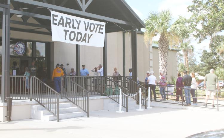 Voters wait in line outside the Columbia County Supervisor of Elections office Monday for the start of early voting for the Nov. 5 general election. (TONY BRITT/Lake City Reporter)