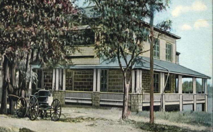 An early 20th-century photo shows the Elks lodge on the banks of Lake DeSoto in Lake City. (COURTESY)