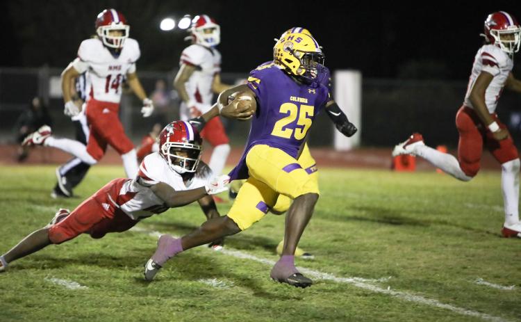 Columbia running back Jerome Horne races past a diving North Miami Beach defender on his way to the end zone for one of his three touchdowns in Friday’s 42-0 win. (BRENT KUYKENDALL/Lake City Reporter)