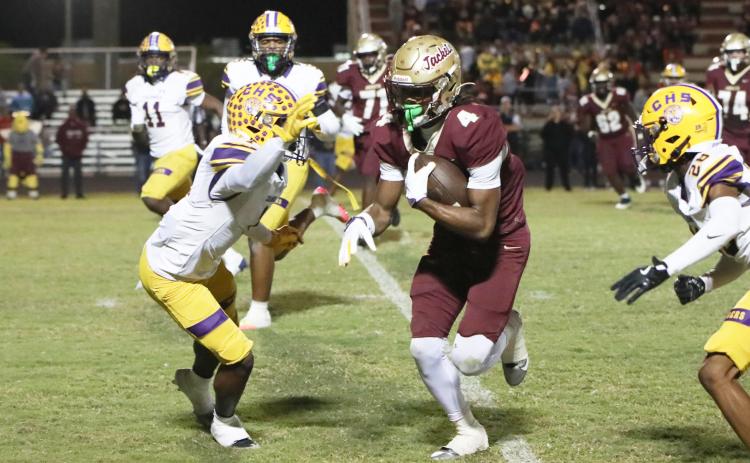 St. Augustine receiver Somourian Wingo runs past Columbia defensive back Zamarion Jones after a catch Friday night in a Region 1-4A quarterfinal. (BRENT KUYKENDALL/Lake City Reporter)