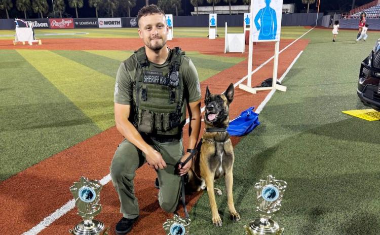 Columbia County Sheriff’s Office Sgt. Matthew Waddington and his K9 partner Cairo earned three awards at the Space Coast Police K-9 Competition on Friday in Viera. Cairo was name dthe fastest dog and the hardest dog while finishing third on the obstacle course. (COURTESY)