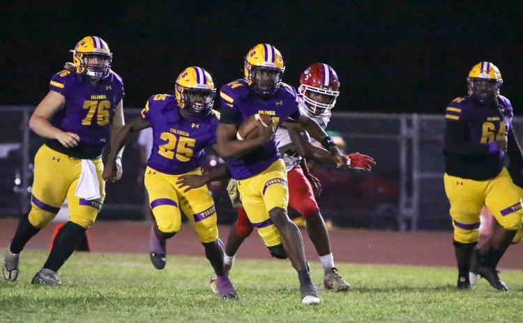 Columbia quarterback Xavier Collins scrambles up the field against North Miami Beach on Nov. 1. (BRENT KUYKENDALL/Lake City Reporter)