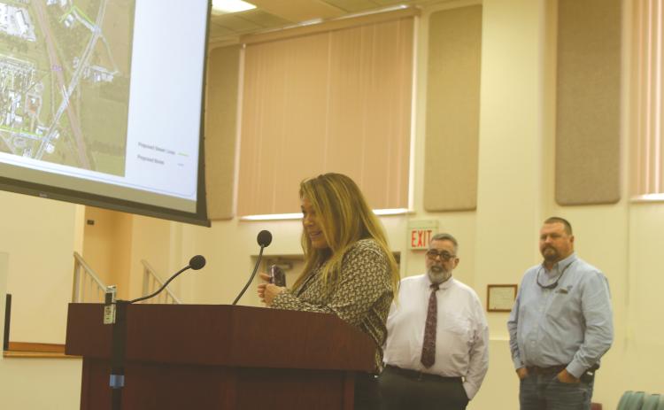 Debi Bennefield (left) speaks during Thursday’s county meeting alongside County Manager David Kraus and Lake City Executive Director of Utilities Steve Brown. (TONY BRITT/Lake City Reporter)