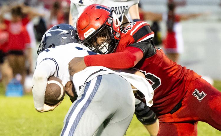 Lafayette defensive lineman Zamarion Hawkins makes a tackle against Brookwood on Sept. 6. (JACK HOWDESHELL/Lake City Reporter)