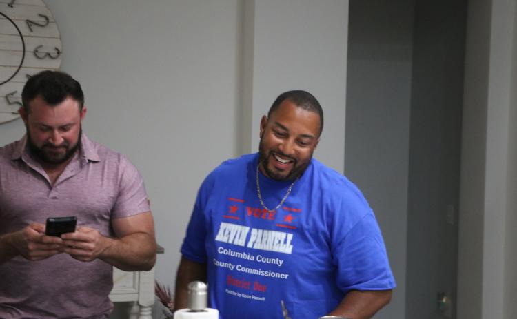 Kevin Parnell is all smiles as he looks at a computer screen at his house as vote totals were coming in Tuesday night. Parnell defeated 43-year incumbent Ron Williams for the District 1 County Commissioner seat. (MORGAN MCMULLEN/Lake City Reporter)