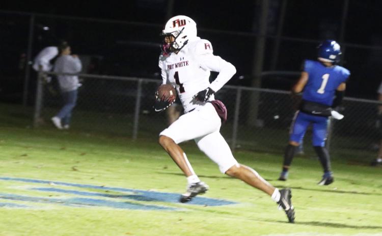 Fort White receiver Mike Peterson Jr. scores on a 14-yard touchdown pass in the third quarter of Friday’s playoff game against Jay. (MORGAN MCMULLEN/Lake City Reporter)