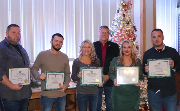 Honored for their work with the Columbia County Sheriff’s Office in 2024 at the agency’s annual Christmas party and awards ceremony were Lt. Ronnie Daniels (from left), Dale Tanksley (Detention Officer of the Year), Hope Crawford (Non-Sworn Employee of the Year), Sheriff Mark Hunter, Jennier Cason (Detective of the Year) and Michael Rooney (Deputy of the Year). Not pictured are Skip Bunner (Volunteer of the Year) and Cathy Davis, who also were recognized. (COURTESY COLUMBIA COUNTY SHERIFF'S OFFICE)