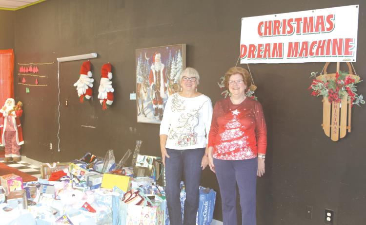 Meally Jenkins (from left), Christmas Dream Machine founder and director and Janet Stanford, Christmas Dream Machine treasurer and secretary, helped collect toys for 670 kids for Christmas this year. (FILE)