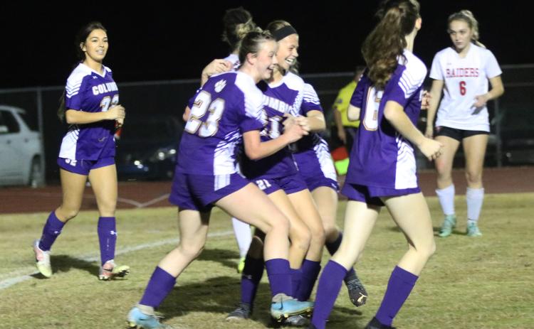 Columbia's Sydney Agner (23) celebrates with Laella Thompson after Thompson scored a goal against Santa Fe on Monday night. (JORDAN KROEGER/Lake City Reporter)