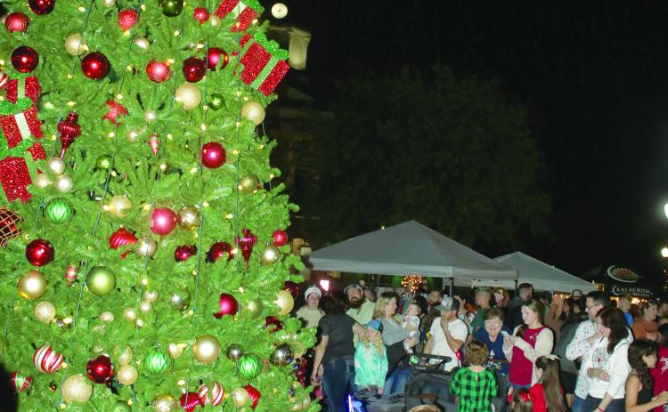 Hundreds attended last year’s Christmas tree lighting ceremony in Olustee Park. This year’s event is set for Sunday. (FILE)