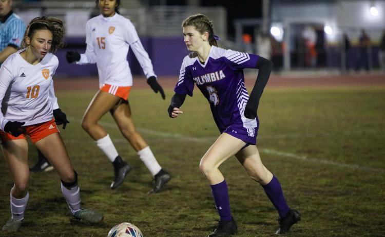 Columbia's Niki Sossie dribbles the ball up the field during a match against Orange Park on Jan. 9. (BRENT KUYKENDALL/Lake City Reporter)
