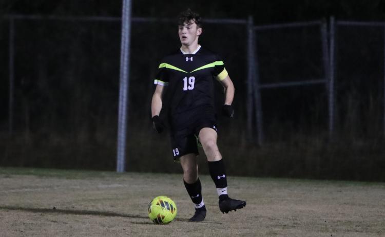 Columbia's Mathan Cook looks up field with possession of the ball during a match against Gainesville on Jan.  10. (BRENT KUYKEDALL/Lake City Reporter)