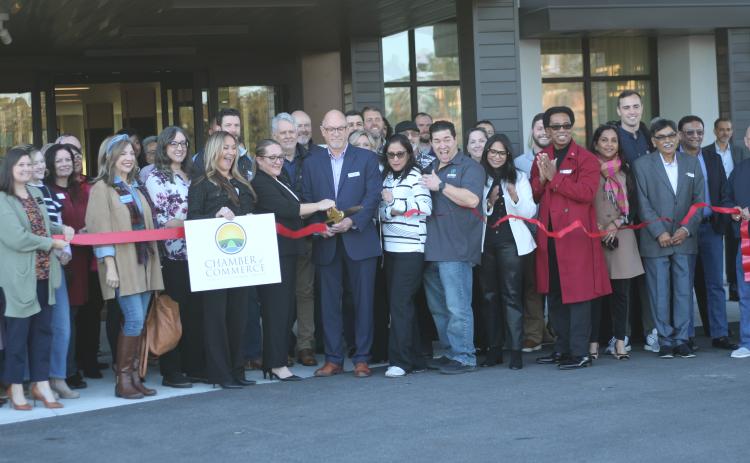 A crowd of area business owners, residents and local supporters attend the ribbon cutting ceremony for the Courtyard by Marriott on Tuesday afternoon. (TONY BRITT/Lake City Reporter)