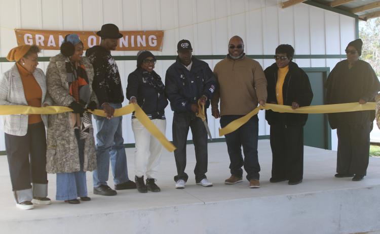 Members of the Annie Mattox Park board cut the ribbon during a grand opening for the Annie Mattox Park pavilion on Monday afternoon. (TONY BRITT/Lake City Reporter)