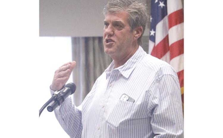 Brad Dicks talks about his beginnings in real estate by helping his father, Lenvil, mark roads in a subdivision nearly 50 years ago. Dicks was named the Lake City Board of Realtors’ Realtor of the Year on Monday. (JAMIE WACHTER/Lake City Reporter)