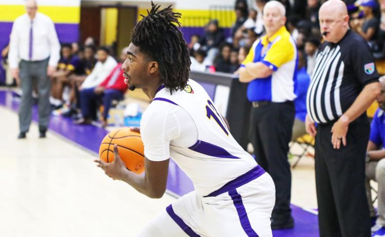Columbia forward Zavian Douglas looks to pass against Palatka on Dec. 18. (BRENT KUYKENDALL/Lake City Reporter)