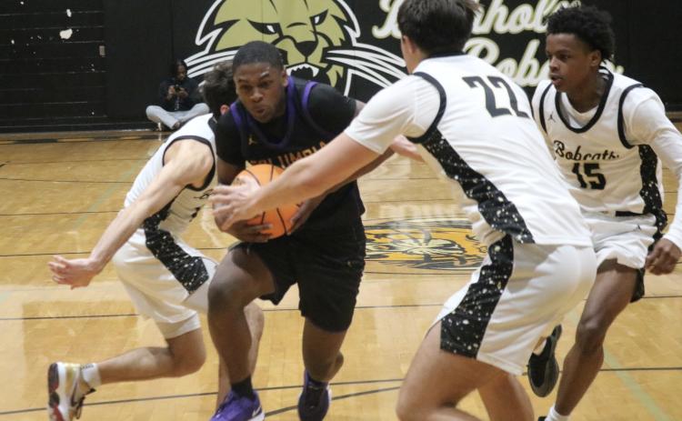 Columbia guard Zamarion Jones drives to the basket in the closing seconds of Tuesday's game against Buchholz. (JORDAN KROEGER/Lake City Reporter)