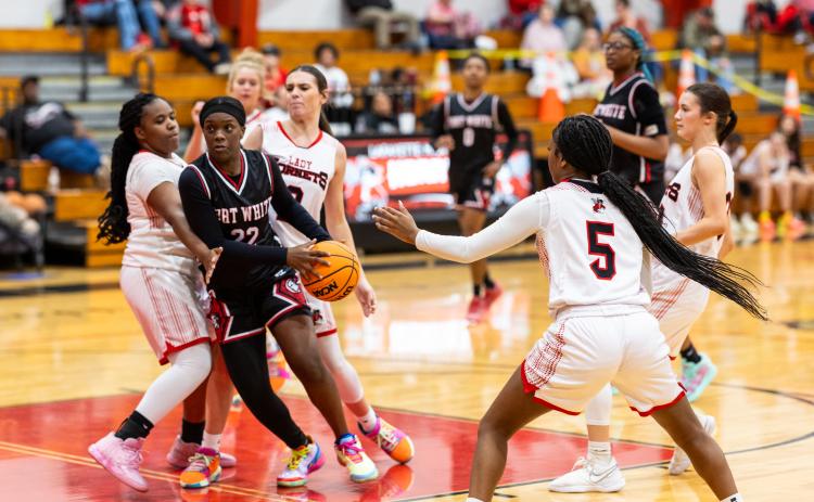 Fort White guard Zuri Hollie drives through the Lafayette defense on Tuesday night. (JACK HOWDESHELL/Lake City Reporter)