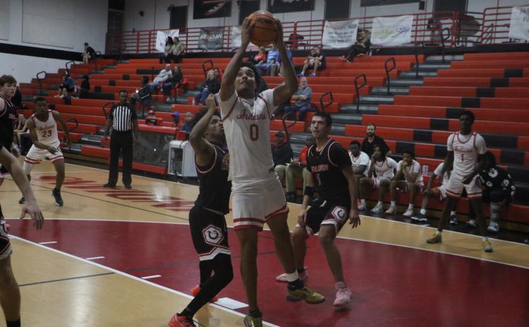 Fort White guard Tafari Moe goes for a layup during Monday's win against Middleburg. (MORGAN MCMULLEN/Lake City Reporter)