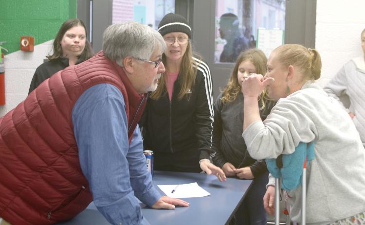 Columbia County Superintendent Keith Couey discusses the closure of Five Points Elementary School and the new proposed zoning for elementary school students with parents and community members Tuesday at a town hall meeting. (TONY BRITT/Lake City Reporter)