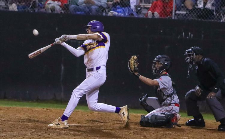 Columbia outfielder Bynton Edge hits a single against Santa Fe on Tuesday night. (BRENT KUYKENDALL/Lake City Reporter)
