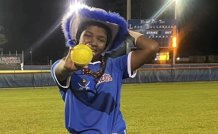 Branford's Mallory Blue shows off her grand slam ball after the Buccaneers defeated Middleburg on Tuesday night. (COURTESY)