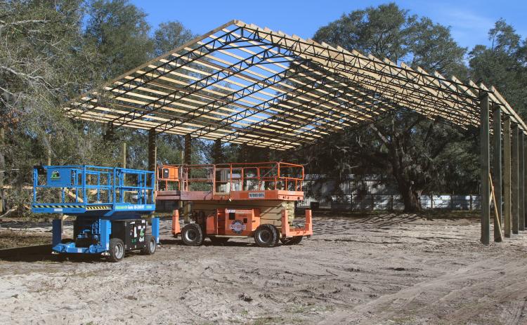 The pole barn at Cooper’s Hideout, which will cover a food truck area, a stage and gaming tables, is nearing completion. Eric Levy, the site’s owner, said the roof could be on the barn by the end of the week. (TONY BRITT/Lake City Reporter)
