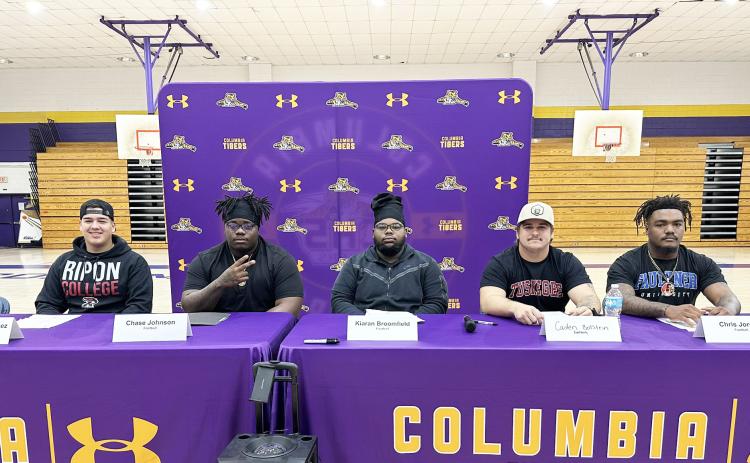 Columbia kicker Rolando Dominguez Jayo (from left), offensive lineman Chase Johnson, offensive lineman Kiaran Broomfield, defensive lineman Caden Bolstein and linebacker Chris Jordan signed letters of intent to play collegiately on Wednesday. Dominguez Jayo and Broomfield are headed to Ripon College, while Johnson and Bolstein will play at Tuskegee and Jordan will suit up for Faulkner. (JORDAN KROEGER/Lake City Reporter)