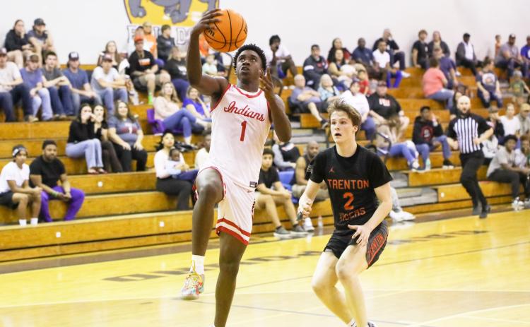 Fort White guard Jayden Jackson rises for a layup against Trenton in the District 6-R championship on Feb. 7. (BRENT KUYKENDALL/Lake City Reporter)