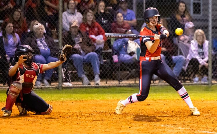 Fort White's Sydnee Mills swings at a pitch against Hamilton County on Tuesday night. (JACK HOWDESHELL/Lake City Reporter)