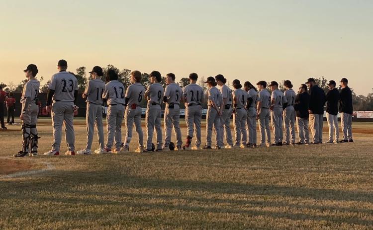 Fort White’s baseball team stands along the first-base line prior to Wednesday’s game against Hamilton County. (COURTESY)