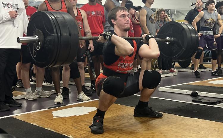 Fort White’s Hayden McCrory performs the clean and jerk during Wednesday’s tri-meet against Columbia and Baker County. (COURTESY)