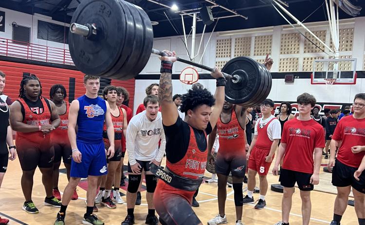 Fort White lifter Lecosta Byrd completes his clean and jerk during Monday’s meet. (COURTESY)