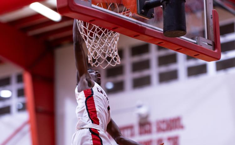 Lafayette guard Jordan Murphy dunks against Fort White on Dec. 5, 2024. (JACK HOWDESHELL/Lake City Reporter)