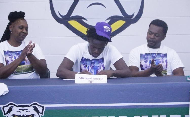 Suwannee receiver MJ Rossin signs his letter of intent to play collegiately at Western Carolina on Wednesday. (JAMIE WACHTER/Lake City Reporter)