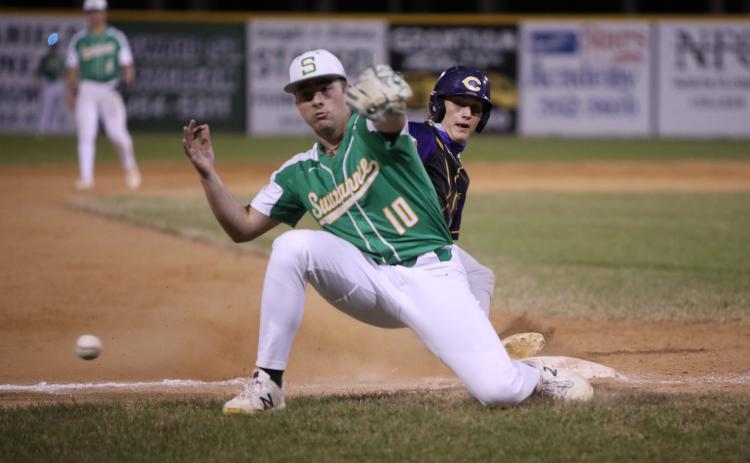 A throw gets past Suwannee third baseman Koy Frier, allowing Columbia shortstop Logan Brooks to score the go-ahead run in the fifth inning Tuesday night. (BRENT KUYKENDALL/Lake City Reporter)