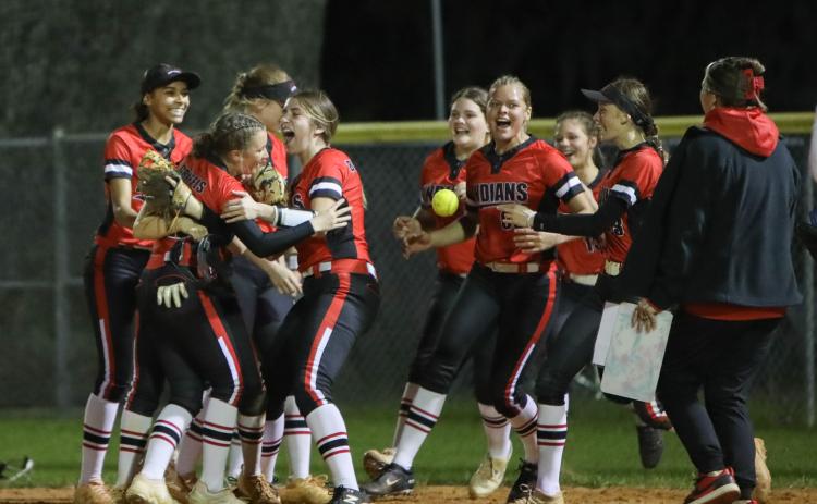 Fort White's softball team celebrates after defeating Columbia 4-3 on Wednesday night. (BRENT KUYKENDALL/Lake City Reporter)