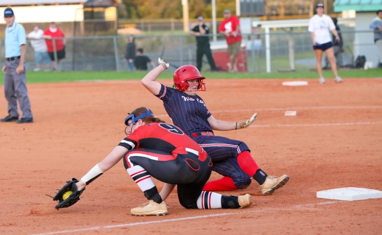 A throw to Fort White third baseman Hannah LeBleu isn't in time during Thursday's game against Wakulla. (BRENT KUYKENDALL/Lake City Reporter)