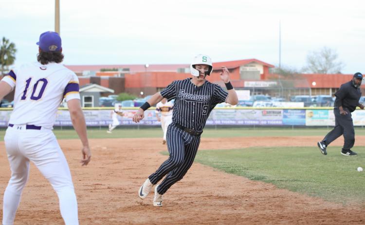 Suwannee third baseman Jace Moran rounds third base to head home for a run against Columbia on Thursday. (BRENT KUYKENDALL/Lake City Reporter)