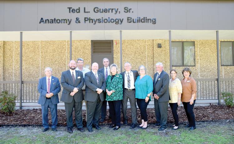 Amy Guerry (middle) is joined by members of the Gateway-Forest Lawn Funeral Home family as they stand in front of the newly-named Ted L. Guerry, Sr. Anatomy & Physiology Building on the Florida Gateway College campus. (COURTESY FLORIDA GATEWAY COLLEGE)