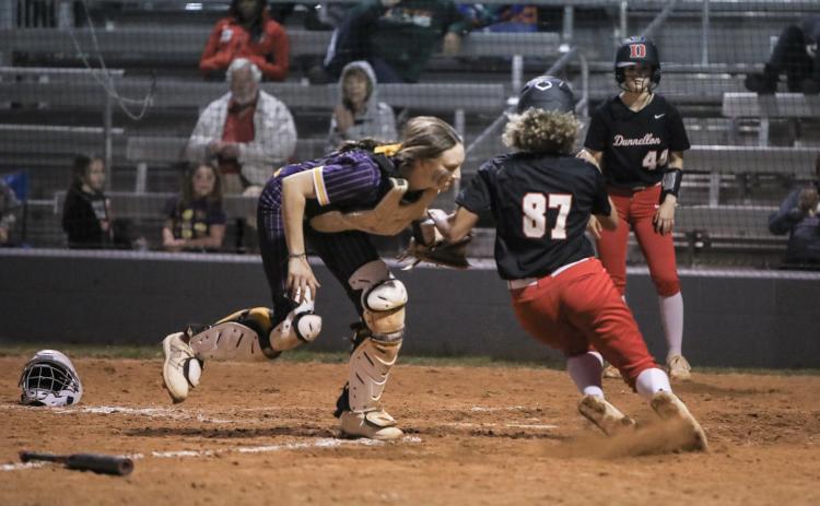 Columbia catcher Emily Delgado tags out Dunnellon center fielder Olivia Joiner to end the game Tuesday night. (BRENT KUYLENDALL/Lake City Reporter)
