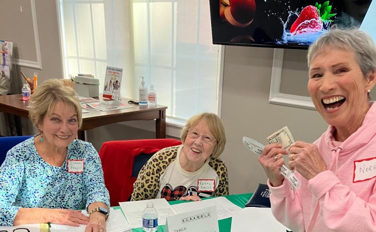 Registration for the Scrabble tournament was a lot of fun with Diane Feagle (from left), Kathy Smith and Nora Riley. (COURTESY)
