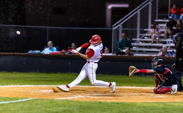 Lafayette third baseman Garrett Taylor hits a double against Fort White on Tuesday night. (JACK HOWDESHELL/Lake City Reporter)
