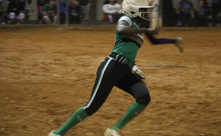 Suwannee center fielder Brianna Stephens rounds first base after hitting an RBI single against Gainesville on Feb. 25. (FILE)