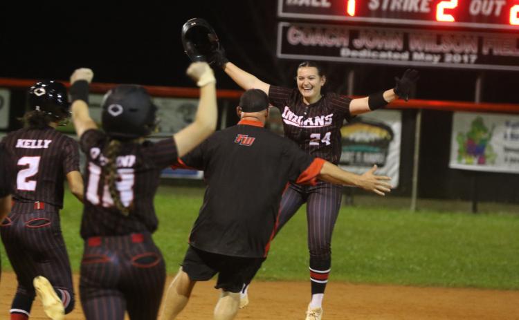 Fort White pitcher Kadence Compton (24) celebrates after her walk-off two-RBI double Tuesday against Santa Fe. (MORGAN MCMULLEN/Lake City Reporter)