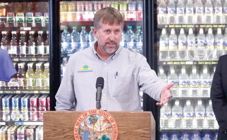 Suwannee County Commissioner Travis Land, pictured speaking at a press conference, said Matco Industries has shown no ambition to build its own rail spur at the county’s Catalyst Site the past 10 years. (FILE)