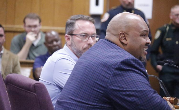 Sen. Corey Simon (right) speaks during the Hamilton County delegation meeting last month while Rep. Jason Shoaf (left) looks on. Simon and Shoaf agreed at that meeting to advance a local bill in the session to abolish the White Springs town government. (FILE)