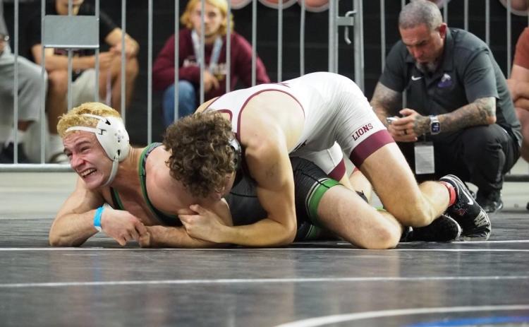 Suwannee wrestler Marshall White battles with First Baptist’s Andres DiGrigoli during the Class 1A IBT finals on Saturday. (DEE DEE JOLICOEUR/Special to the Reporter)