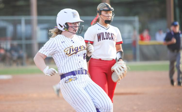 Columbia third baseman Alex Collins reaches first base after hitting a single against Baker County on April 17. (BRENT KUYKENDALL/Lake City Reporter)